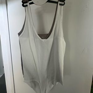 Two new never used stretchy body suits